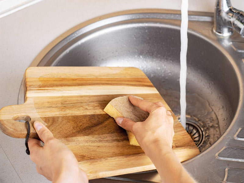 Why should you wash wooden cutting boards